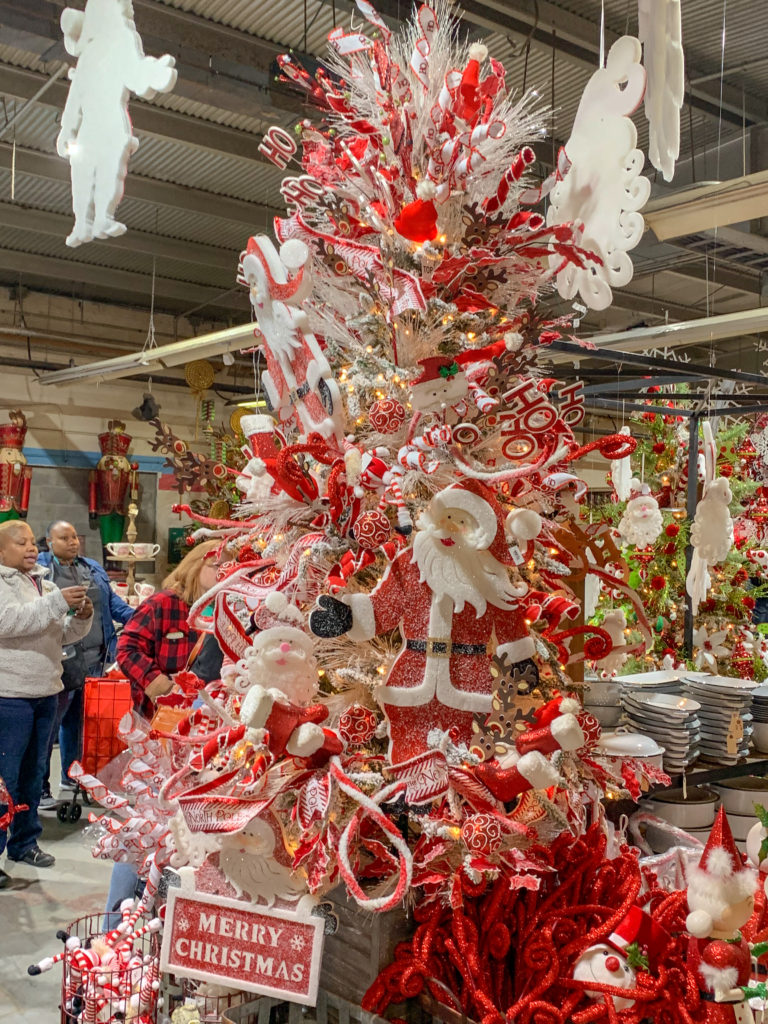 Santa decorations adorn a Santa tree in a Christmas display