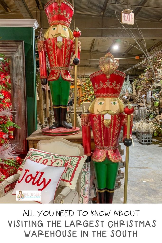 large nutcracker stands beside festive chair at Guess and Company Christmas Warehouse
