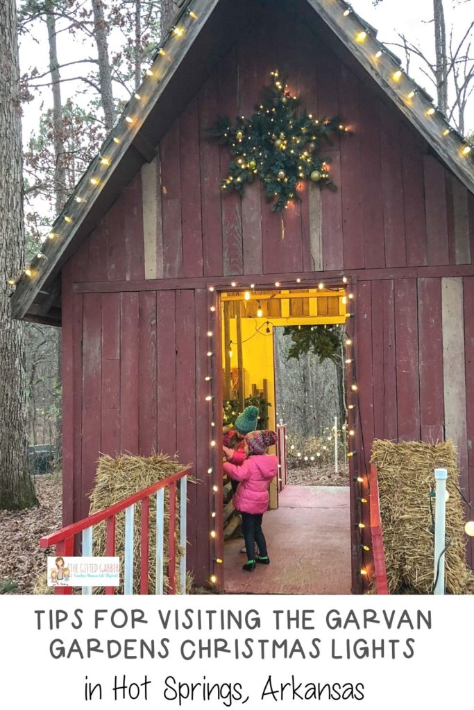 little girls in a reindeer stable at Garvan Gardens Christmas lights