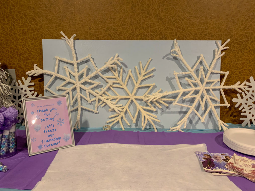 large flocked snowflake decorations at kids' cinema party at a movie theater in Little Rock