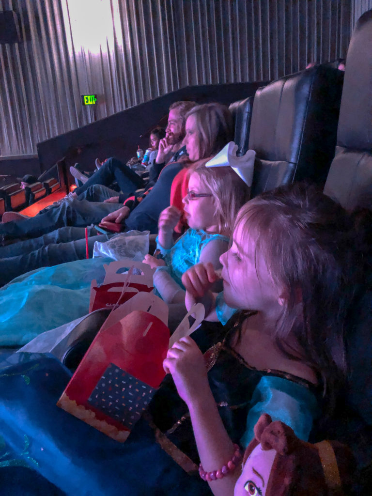 little girls watching Frozen 2 at movie theater birthday party at Rave Movie Theater in Little Rock