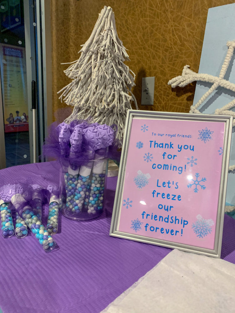 Frozen party decorations at snowflake party theme at movie theater birthday party