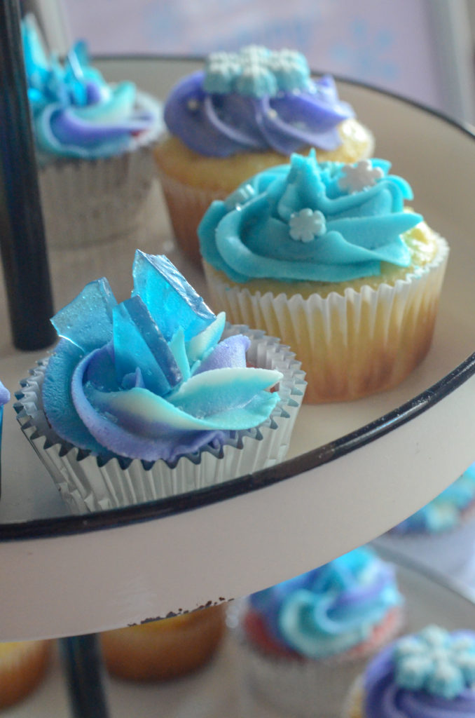Frozen cupcakes with snowflake decorations for a Frozen themed birthday party at Rave Move Theater in Little Rock, AR