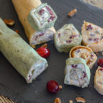 tortilla roll ups on black tray