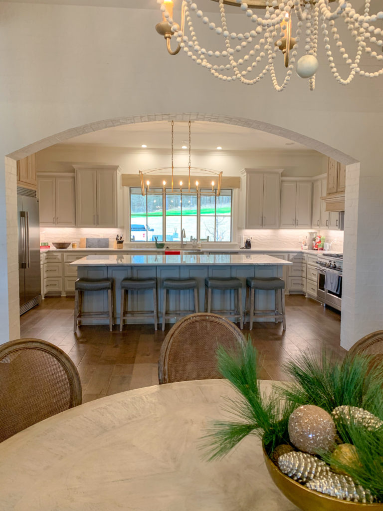 view from the dining area into a modern farmhouse kitchen 