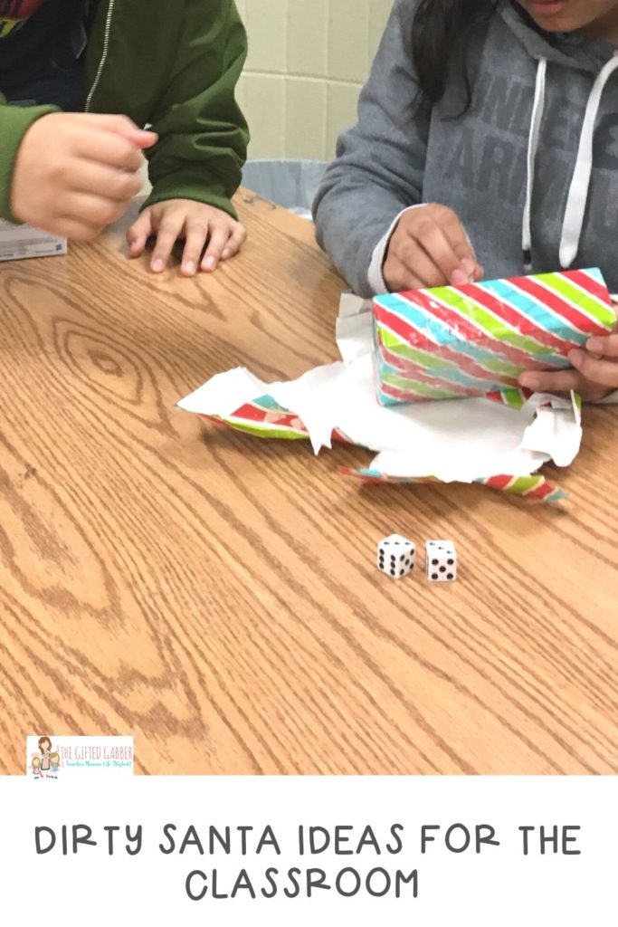 students play by the rules for Dirty Santa with dice while opening Dirty Santa gifts in classroom