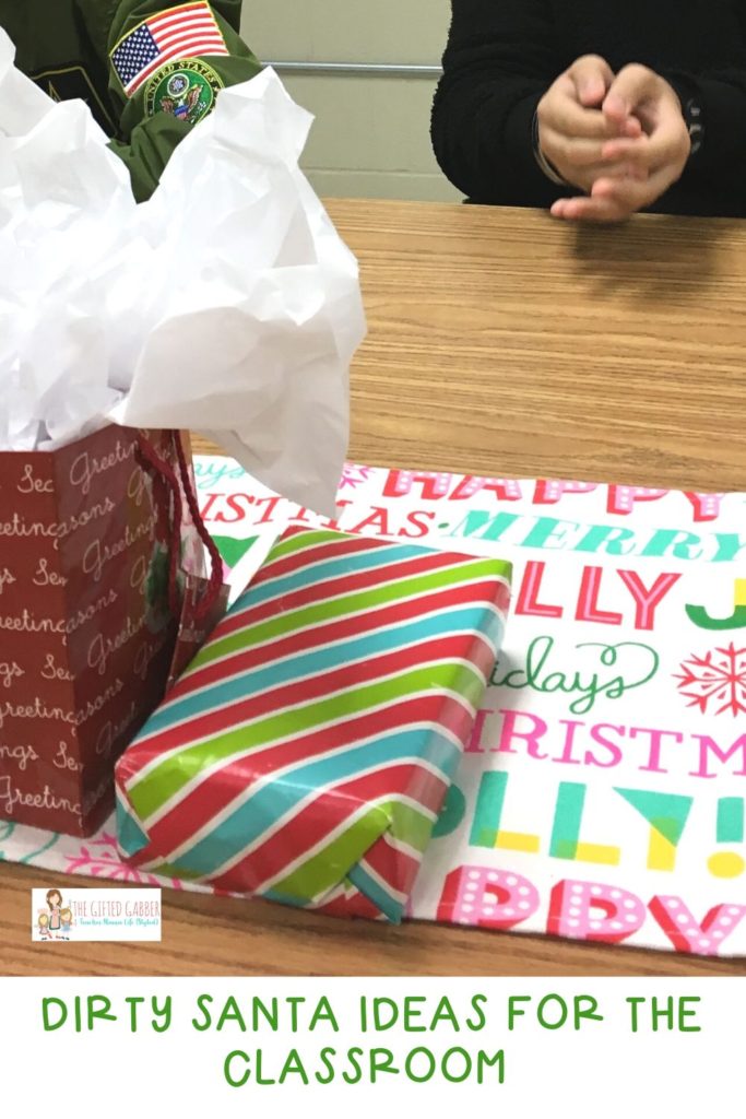 Dirty Santa gifts on classroom table while students listen to rules of Dirty Santa