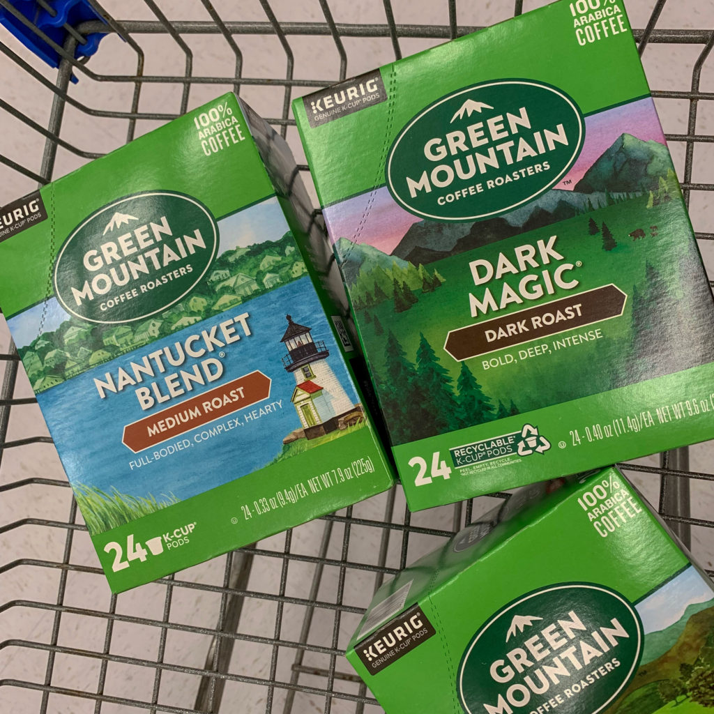 Walmart shopping cart with three boxes of Green Mountain Roasted Coffee