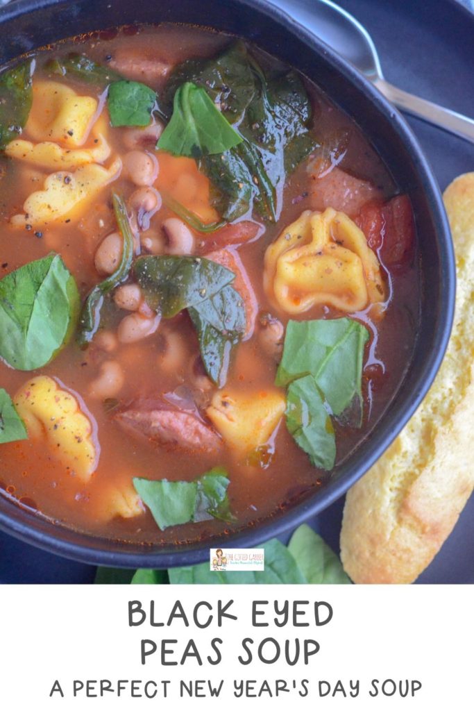 purple hull pea recipe with sausage and spinach in black bowl with cornbread on side