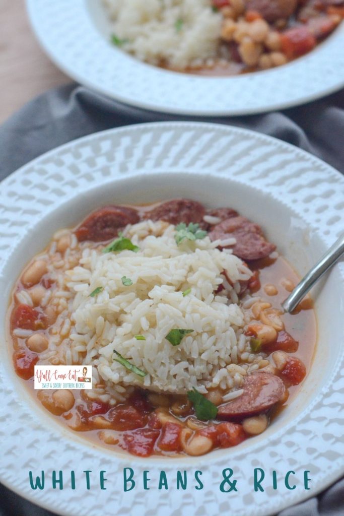 two white bowls with white beans and rice sausage soup and text overlay