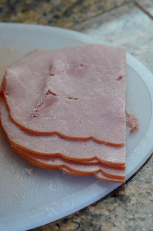 slices of deli meat on cutting board