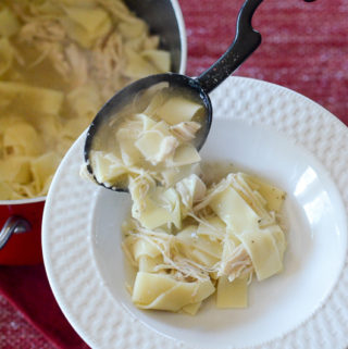chicken soup with Amish noodles in white bowl