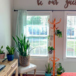 home office guest room view with be our guest wall art