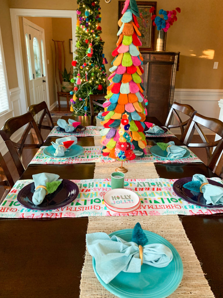 a dining table with bohemian Christmas decorations 