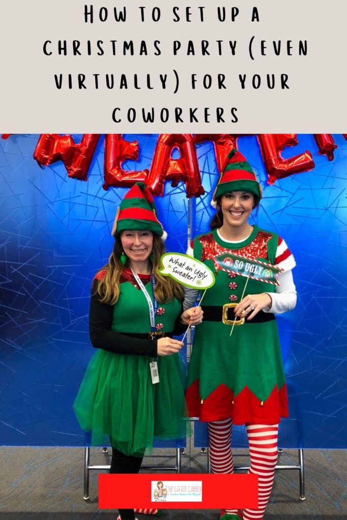 two women pose with signs for an ugly Christmas sweater contest at work