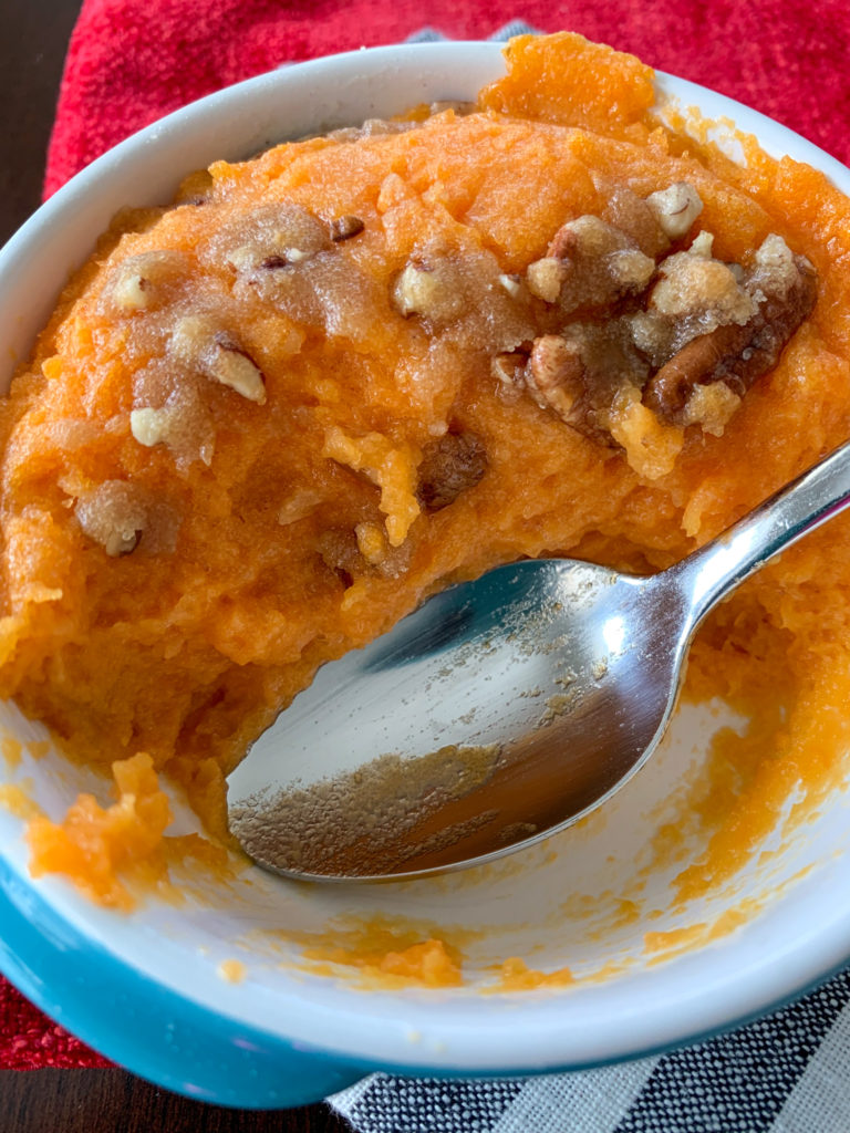 make ahead sweet potato casserole halfway empty in serving dish with spoon