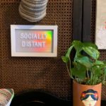 socially distant social distancing quotes letter board with plant in a Frida Kahlo pot
