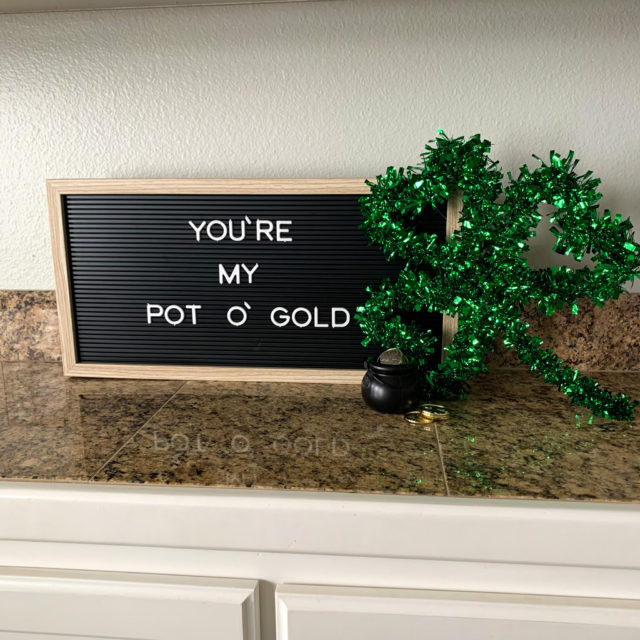 black letter board with St. Patrick's Day sayings and St. Patrick's Day decor