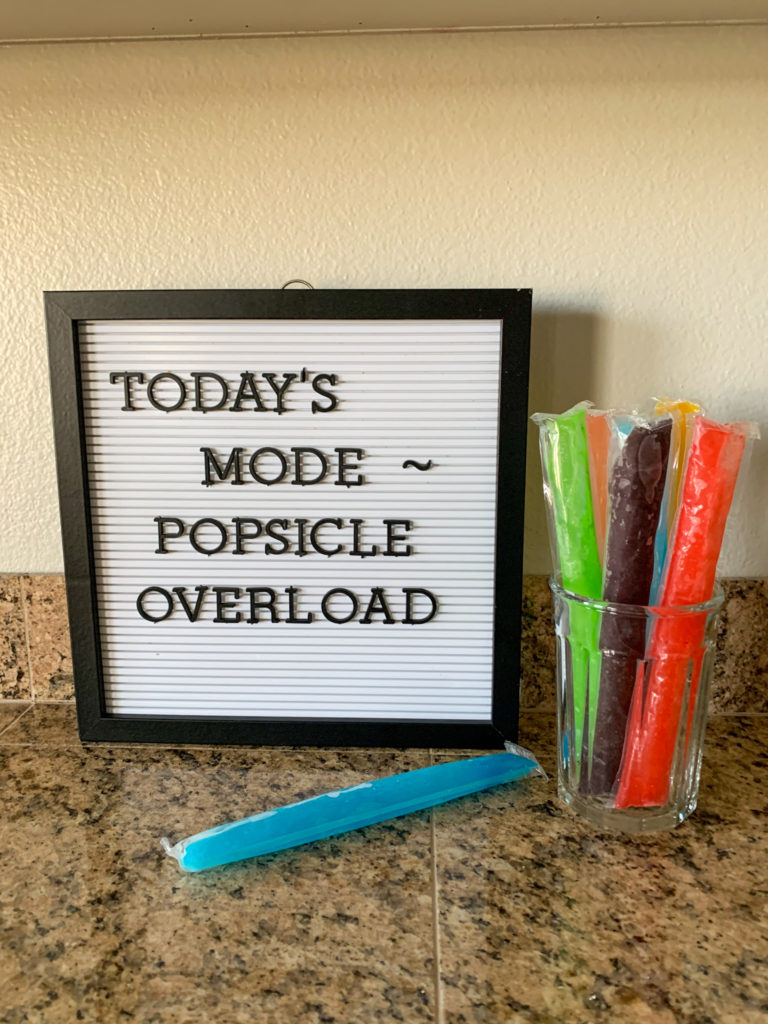 summer letter board quotes about popsicles with glass of popsicles beside letter boards