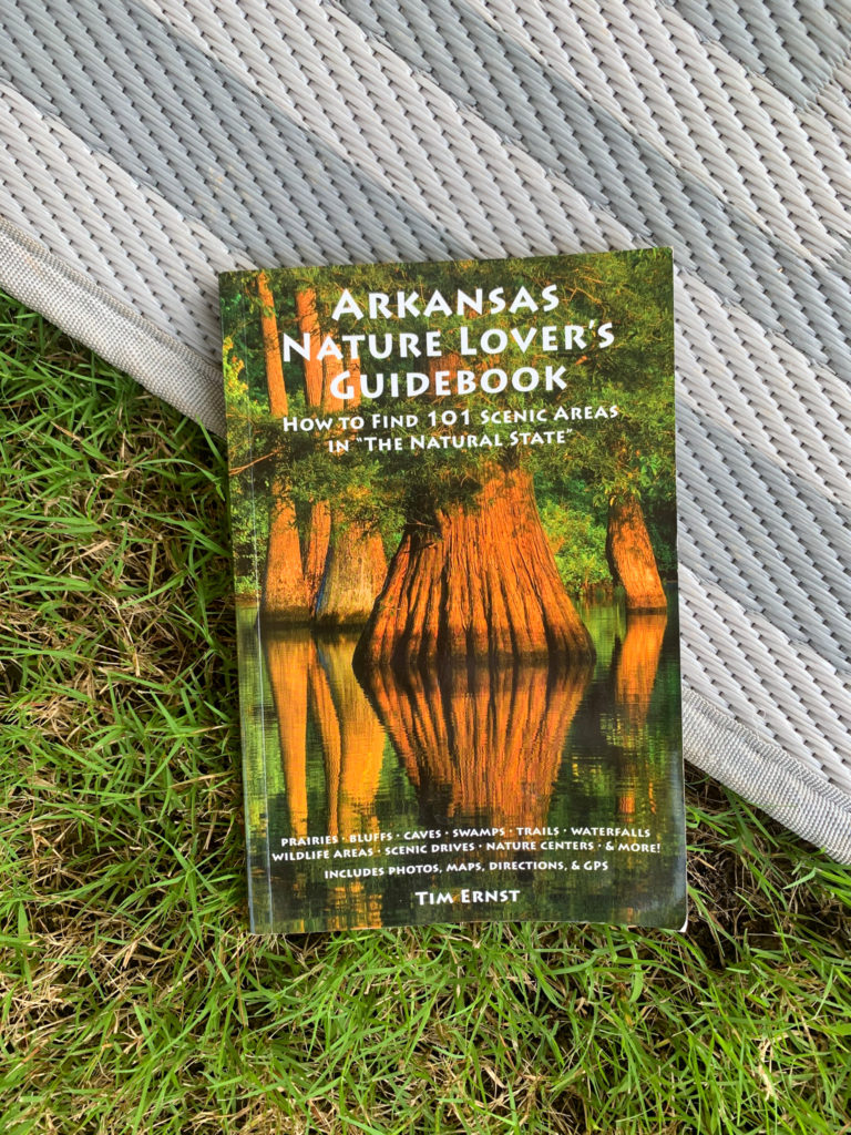 Arkansas book on grass and outdoor mat