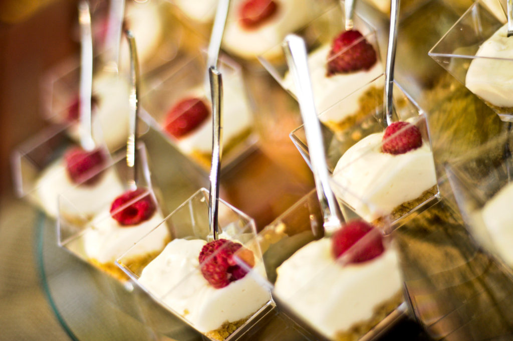 group of mini cheesecakes served in mini glass containers for a wedding dessert bar at Alda's Magnolia Hill, one of the top Little Rock Arkansas wedding venues