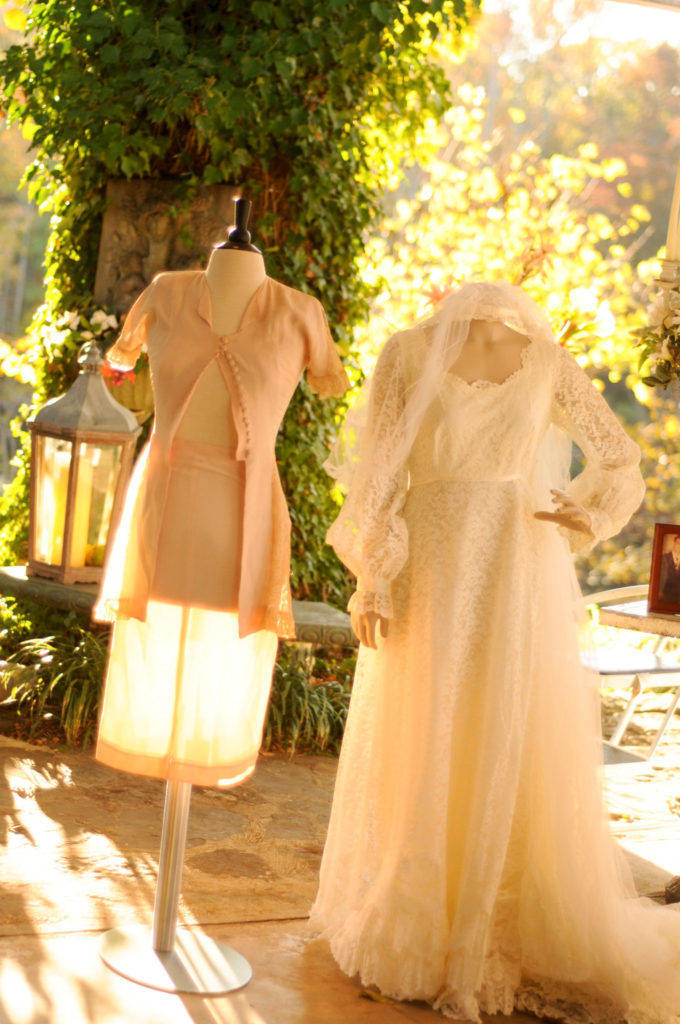 a grandmother's wedding dress from the 1930s and a mother's wedding dress from the 1970s are on display at an Arkansas wedding at Alda's Magnolia Hill 