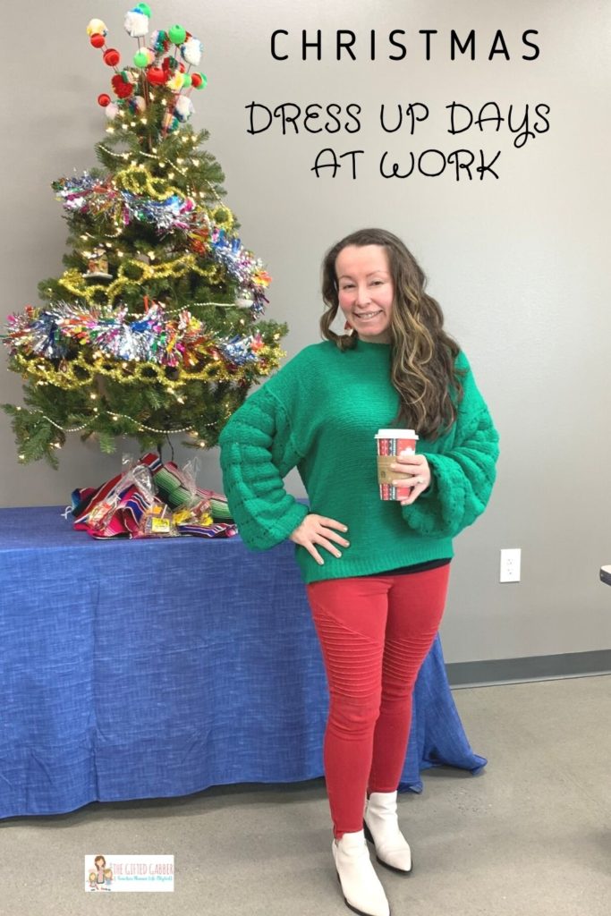 woman wearing red, white, and green for Christmas dress up days at work while standing in front of small Christmas tree