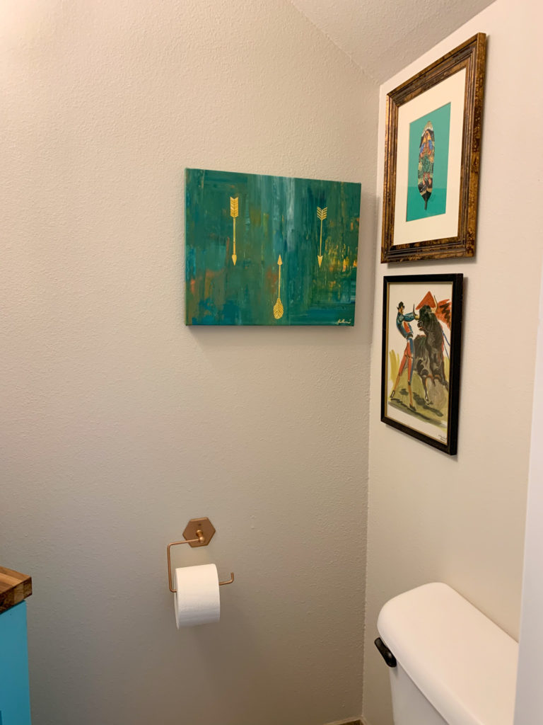 a gallery wall corner with global art from Panama and Mexico 