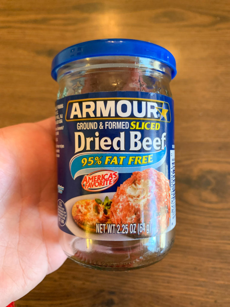 woman holds jar of Armour Chipped beef
