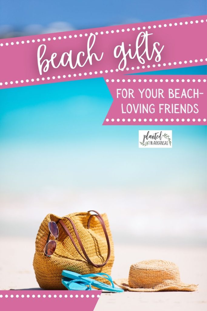 beach gifts on beach including beach bag, flip flops and hat with a text overlay