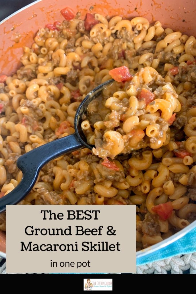 cheesy ground beef and macaroni skillet being scooped out of pot