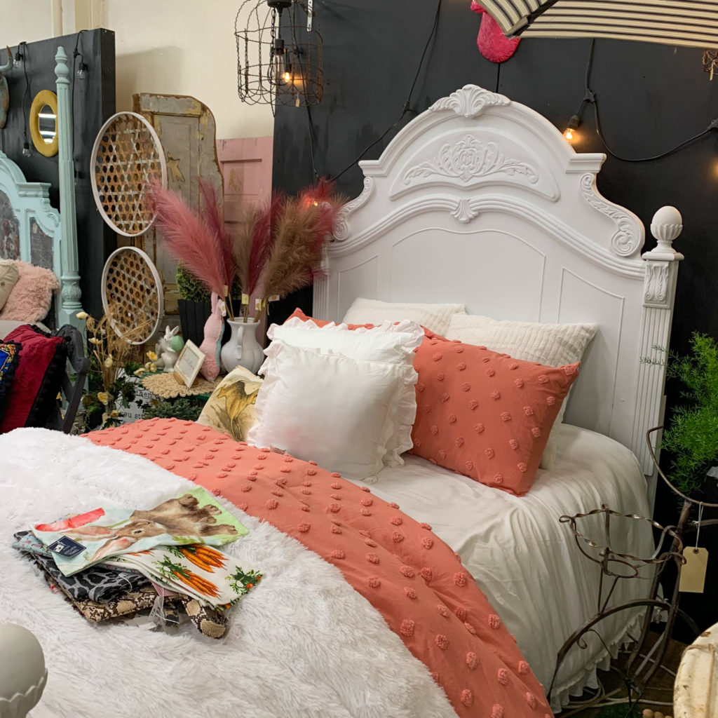 a beautifully styled bed on display at Vintage Market Days Little Rock