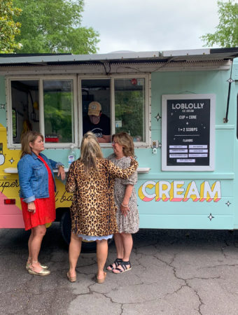 Arkansas women standing in front of Loblolly Creamery truck at ice cream truck party