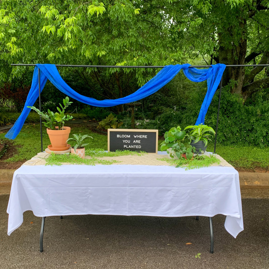 a boho table with over the table rod at a teacher retirement party