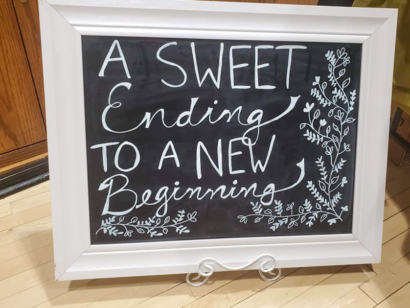 a chalkboard retirement sign in a frame