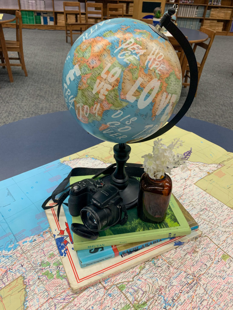 a modern globe on a table at a teacher retirement party