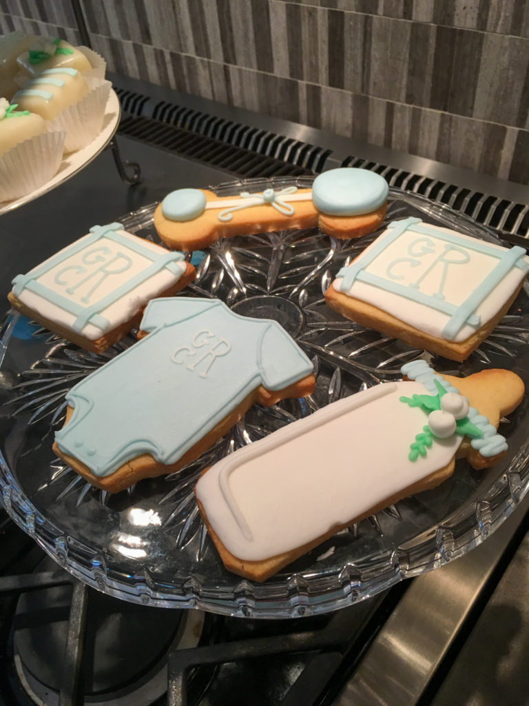 onesie cookies and monogrammed cookies for blue baby shower ideas