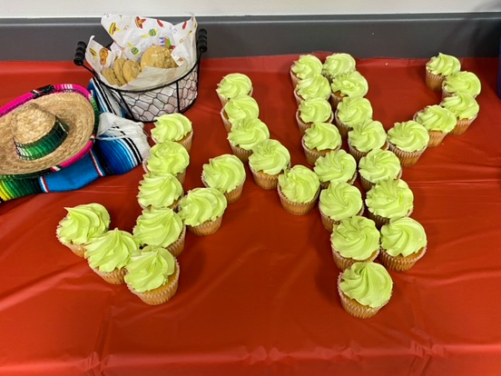 green cactus cupcake cake on red tablecloth