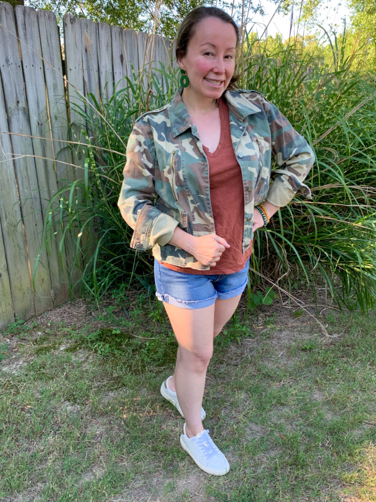 woman wears camouflage jacket for camouflage Animal Kingdom outfit ideas