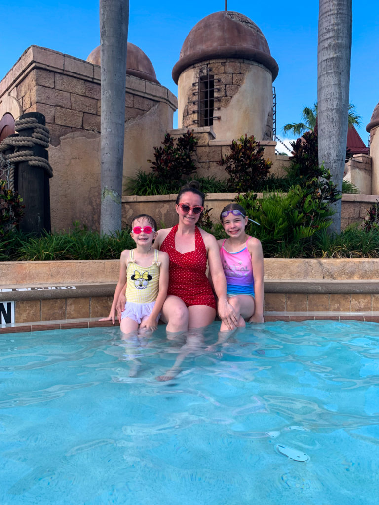 mom and daughters in featured Caribbean Beach Resort pool