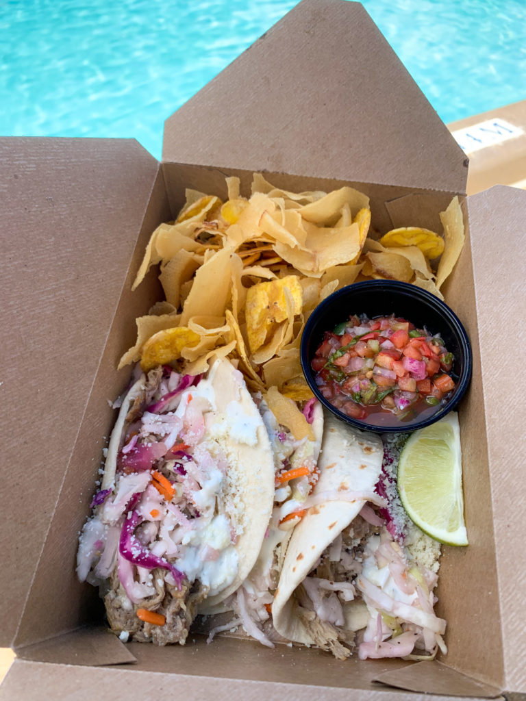 fish tacos and yuca chips in front of pool 