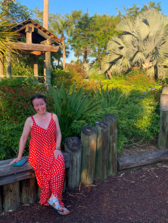 woman showing what to wear to Disney World while seated at Caribbean Beach Resort