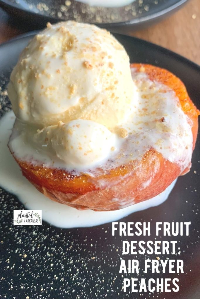 air fryer peaches with ice cream on black plate with white text
