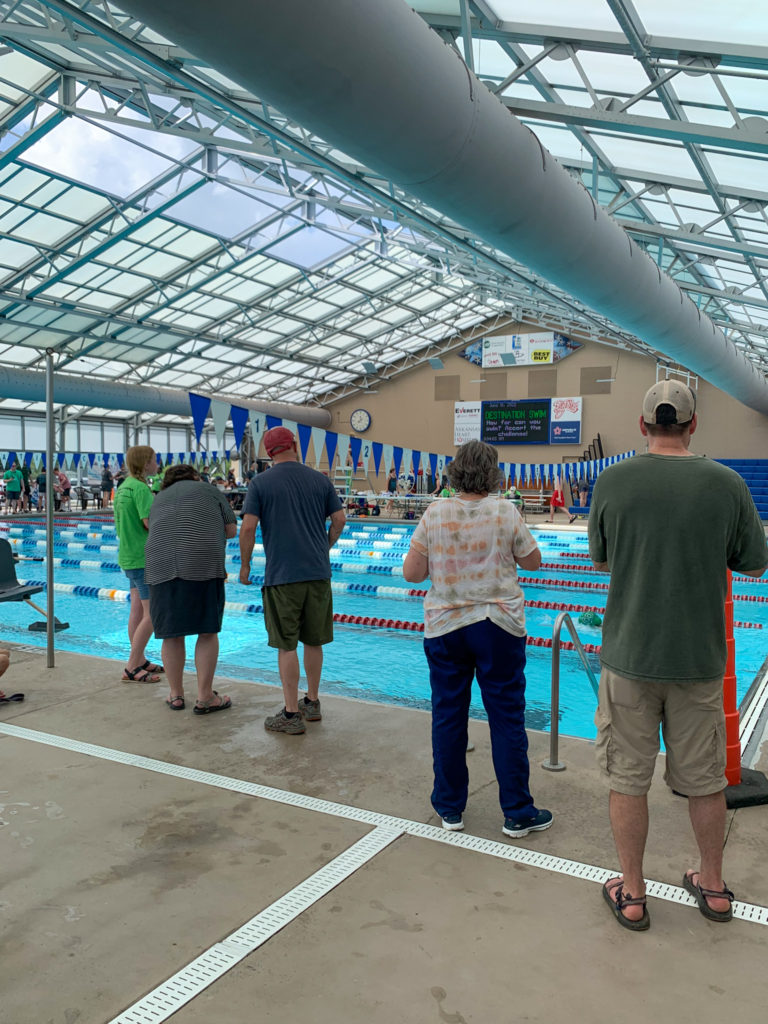 spectators at a youth swim meet event