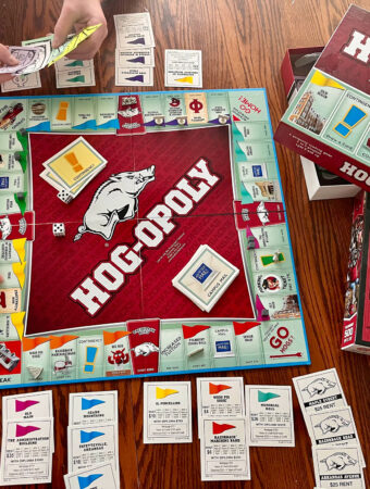 kids playing an Arkansas Razorback board game - Hogopoly and a Razorback puzzle