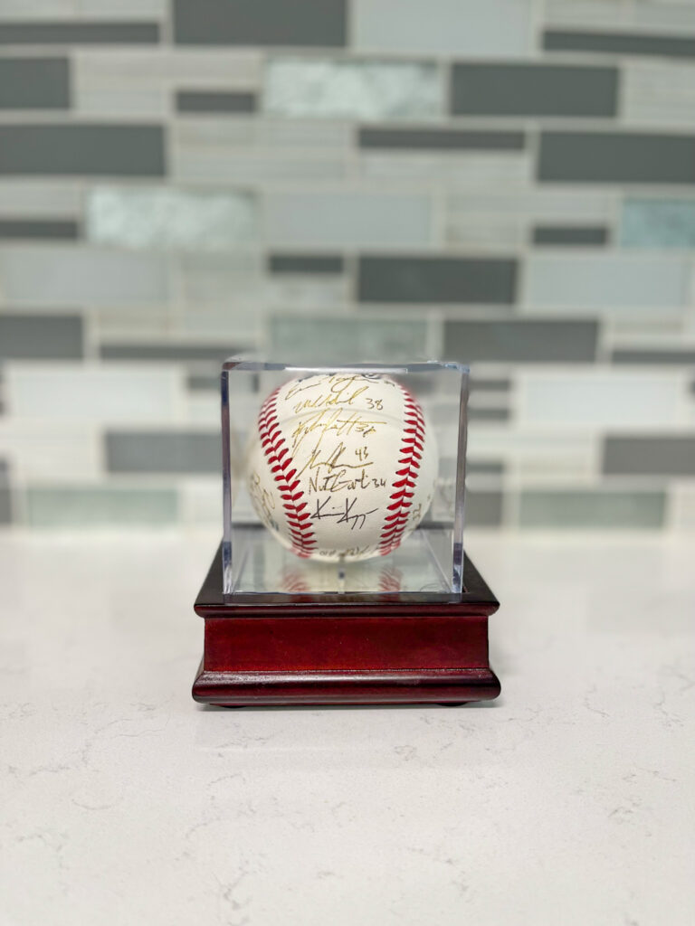 Arkansas Razorback baseball in a glass baseball case for Arkansas Razorback gift ideas for baseball