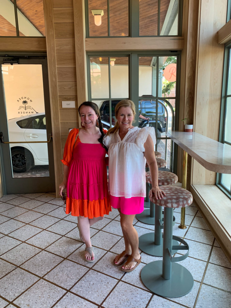 two women standing in The Ryder Hotel lobby 