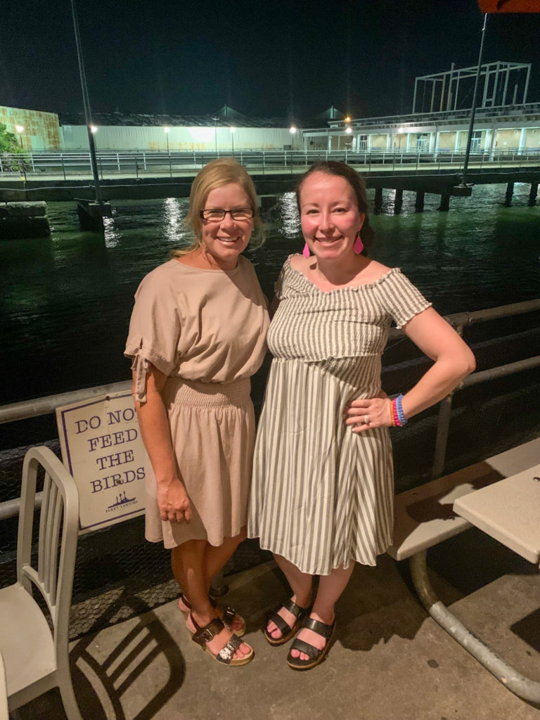 ladies posing at Fleet Landing in casual Charleston outfits