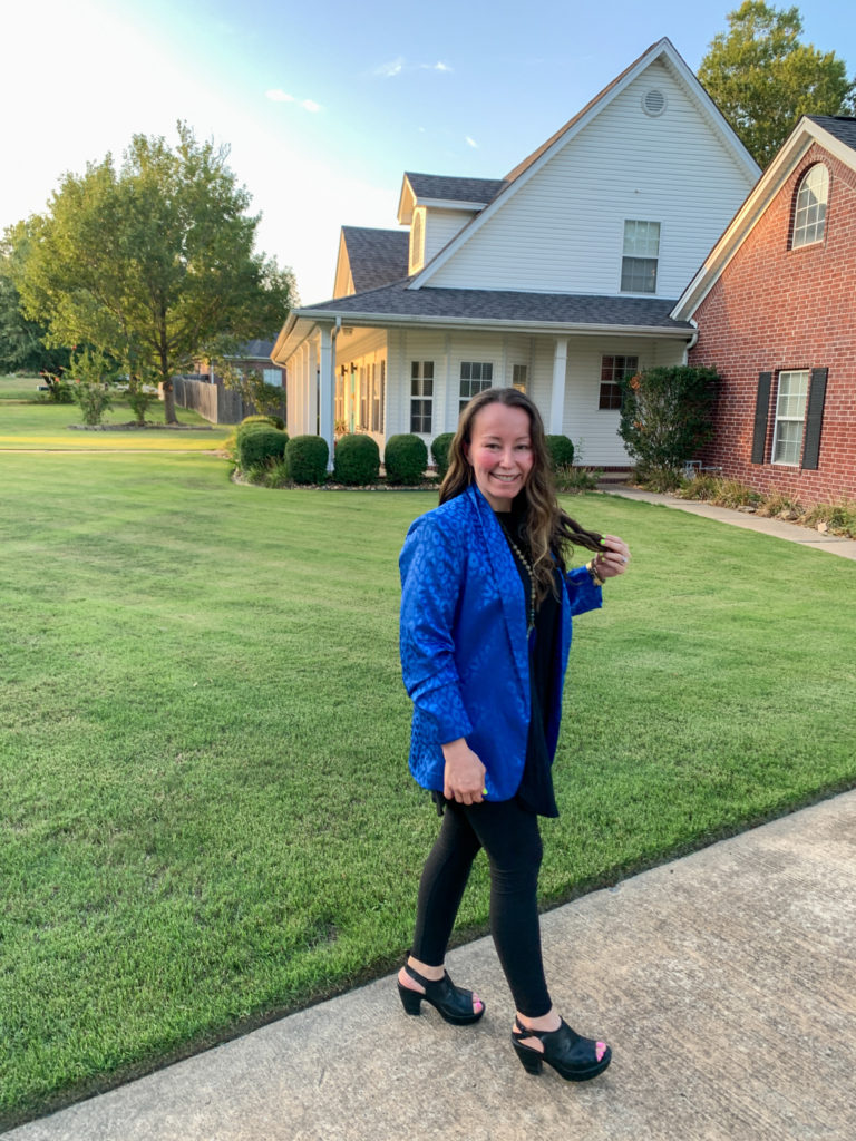 woman wears blue blazer with leggings in driveway for professional teacher outfits idea