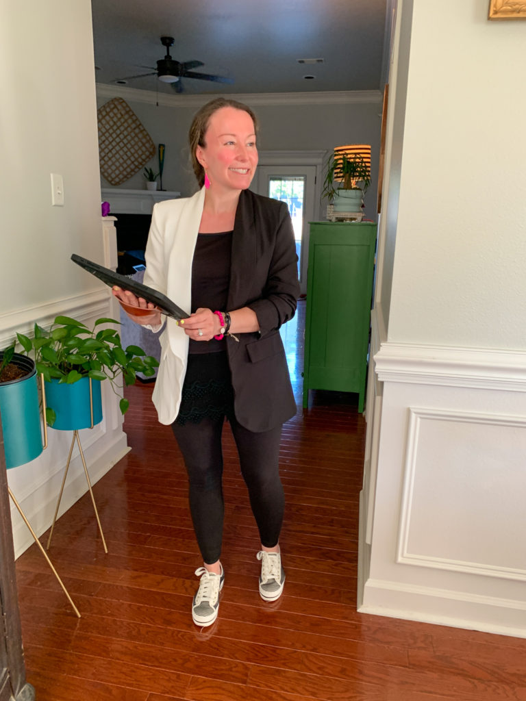 woman wears black and white blazer with tennis shoes and leggings as fun outfits with blazers idea